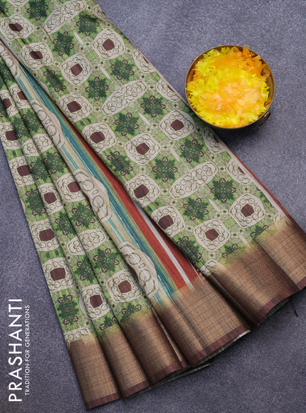 Semi matka saree light green and brown with allover prints and zari woven border