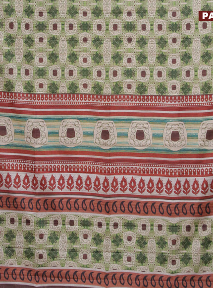 Semi matka saree light green and brown with allover prints and zari woven border