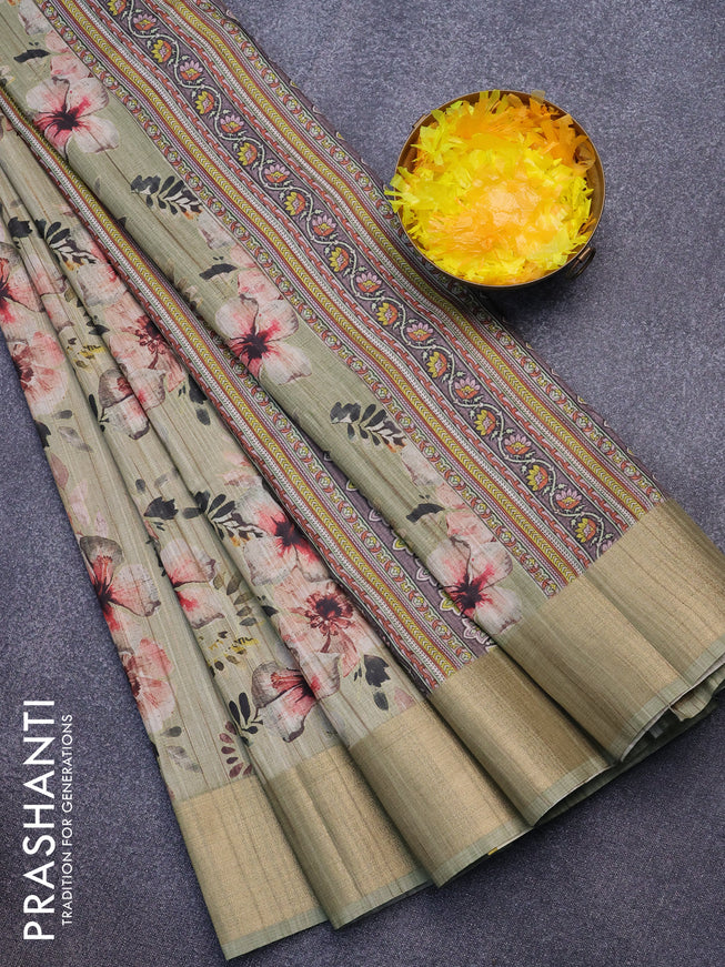 Semi matka saree pastel green with allover floral prints and zari woven border