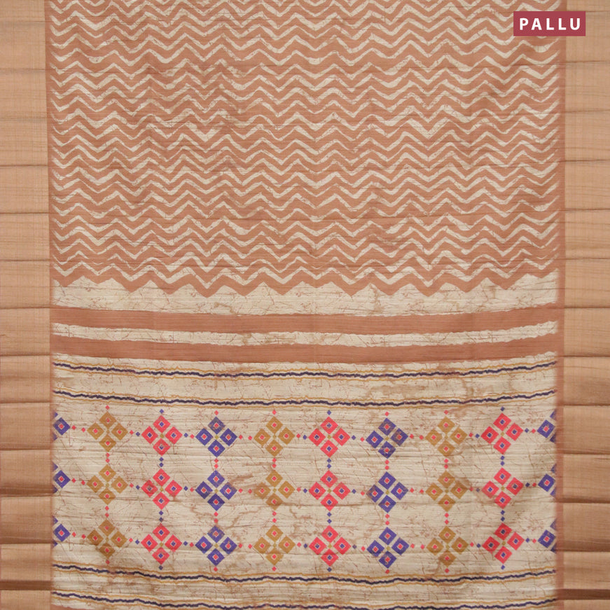 Semi matka saree dark sandal and beige with allover zig zag prints and zari woven border