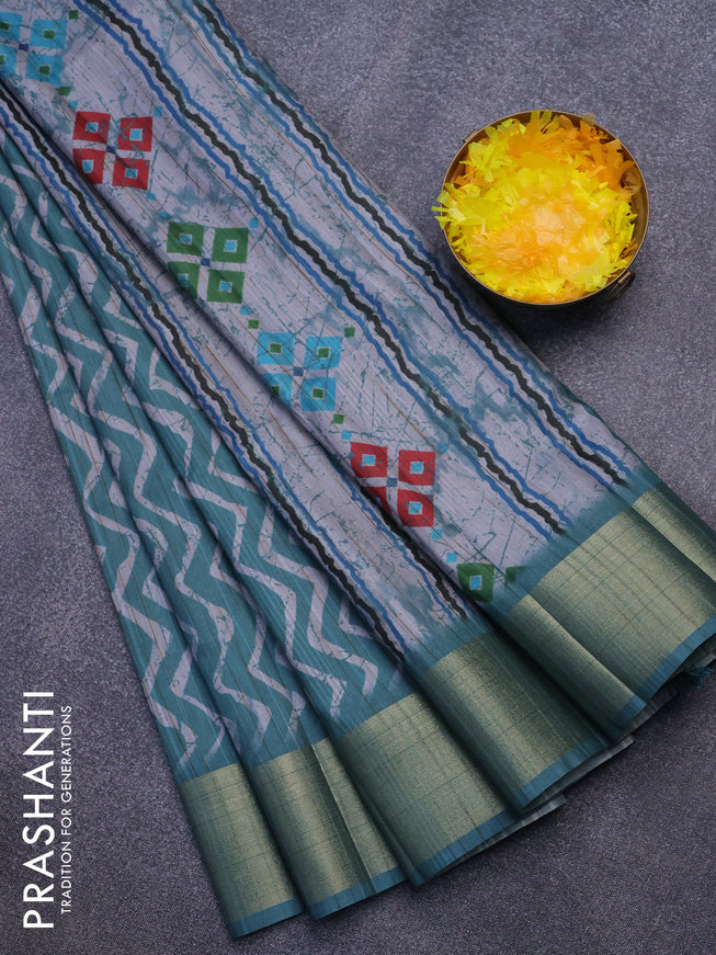 Semi matka saree teal green and grey shade with allover zig zag prints and zari woven border