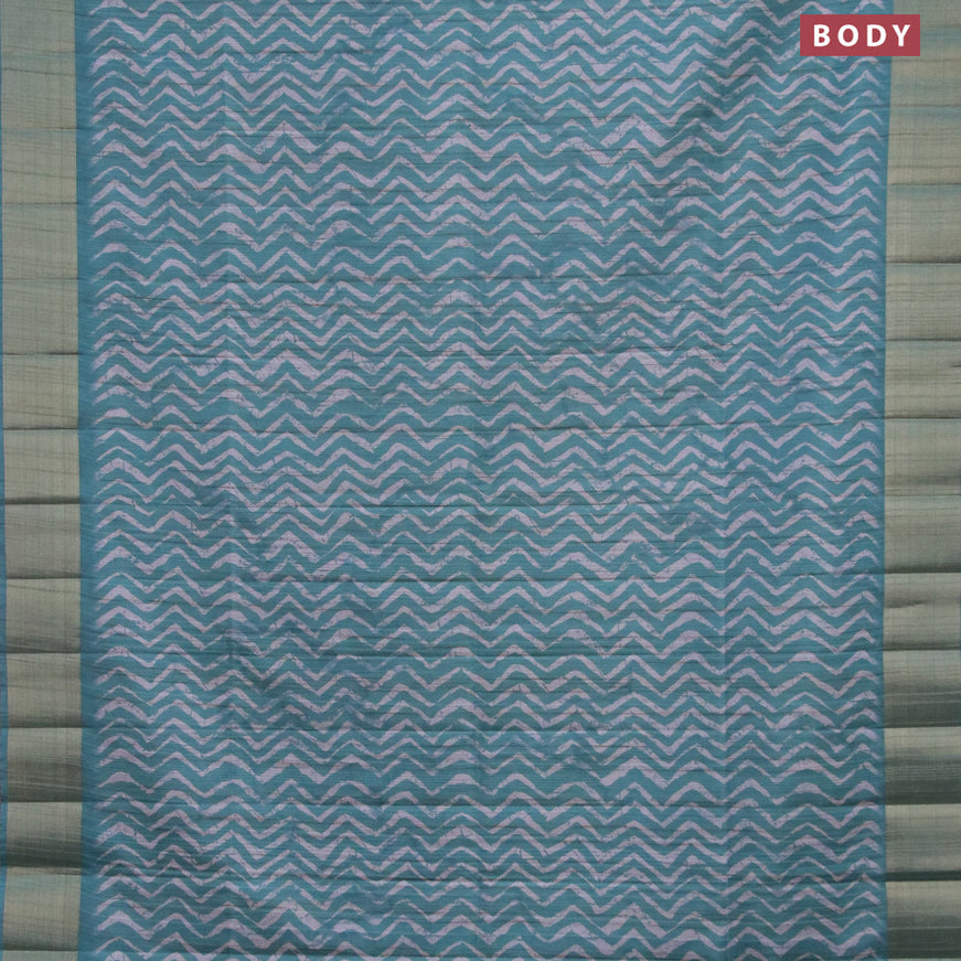 Semi matka saree teal green and grey shade with allover zig zag prints and zari woven border