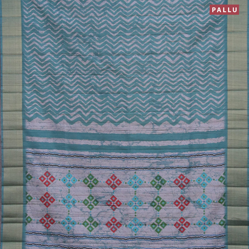 Semi matka saree teal green and grey shade with allover zig zag prints and zari woven border