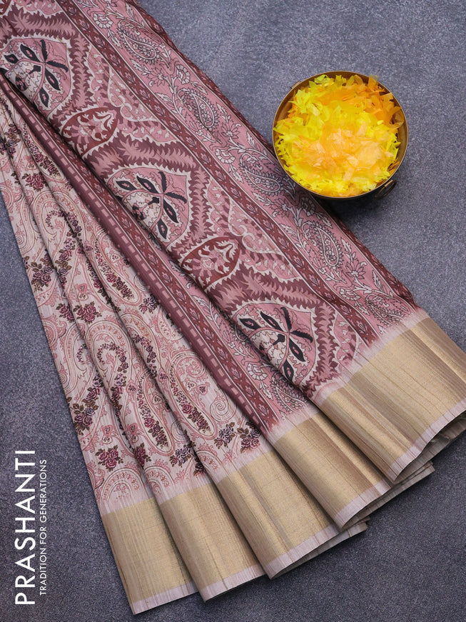 Semi matka saree beige and peach shade with allover paisley prints and zari woven border
