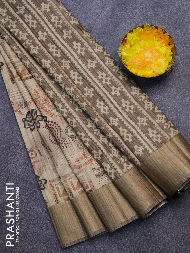 Semi matka saree beige and pastel brown shade with allover prints and zari woven border