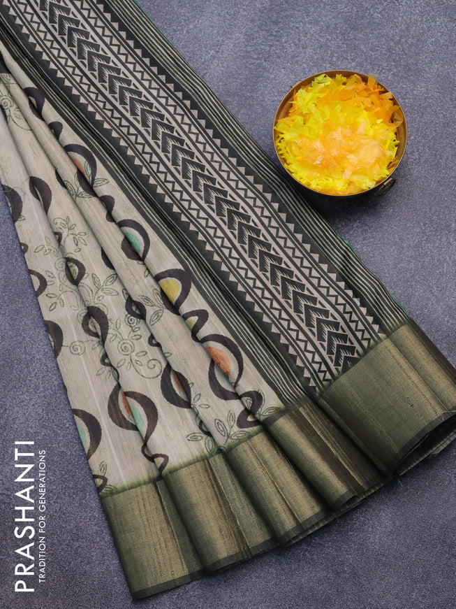 Semi matka saree beige and green shade with allover prints and zari woven border