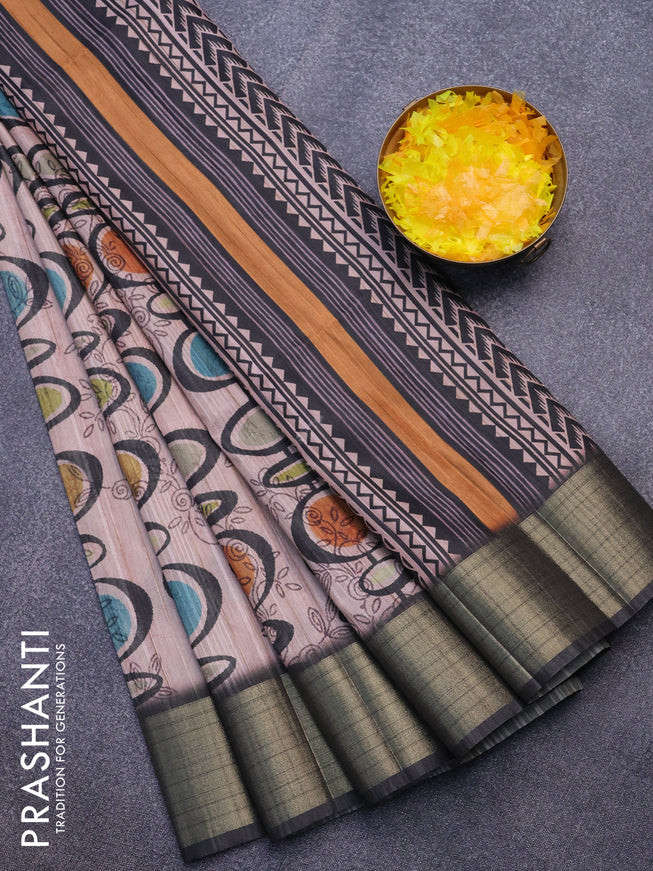 Semi matka saree peach shade and dark grey with allover prints and zari woven border