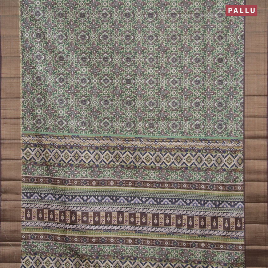 Semi matka saree pastel green and brown with allover prints and zari woven border