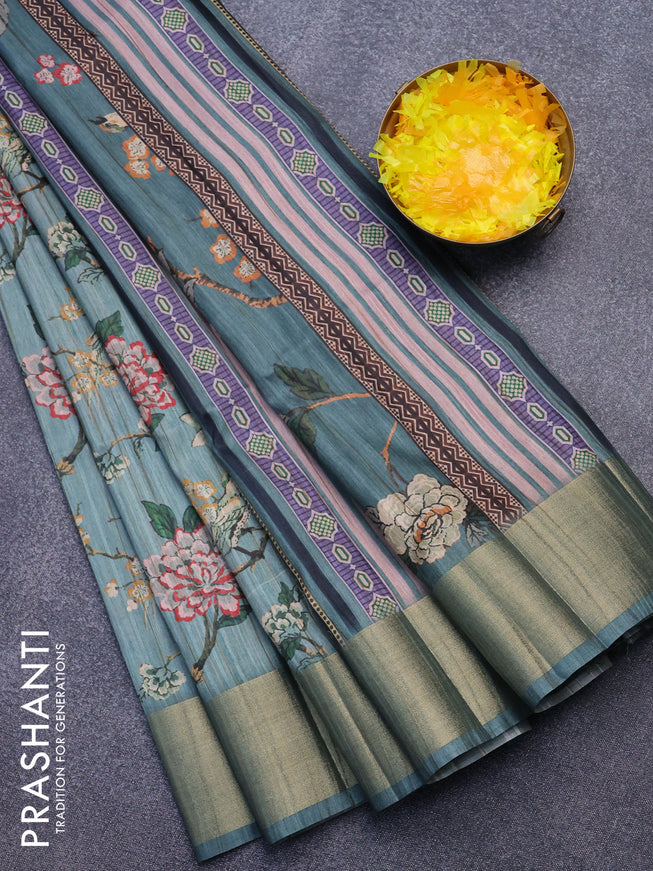 Semi matka saree pastel blue shade with allover prints and zari woven border