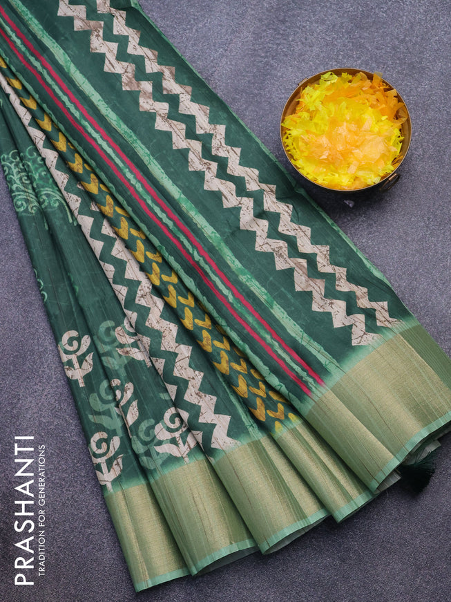 Semi matka saree green and pastel green with allover butta prints and zari woven border