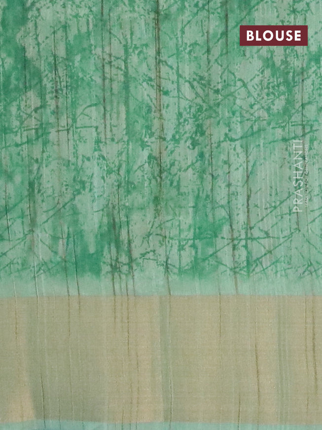 Semi matka saree green and pastel green with allover butta prints and zari woven border