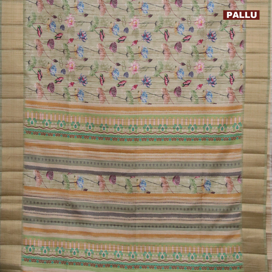 Semi matka saree pastel green shade with allover floral prints and zari woven border