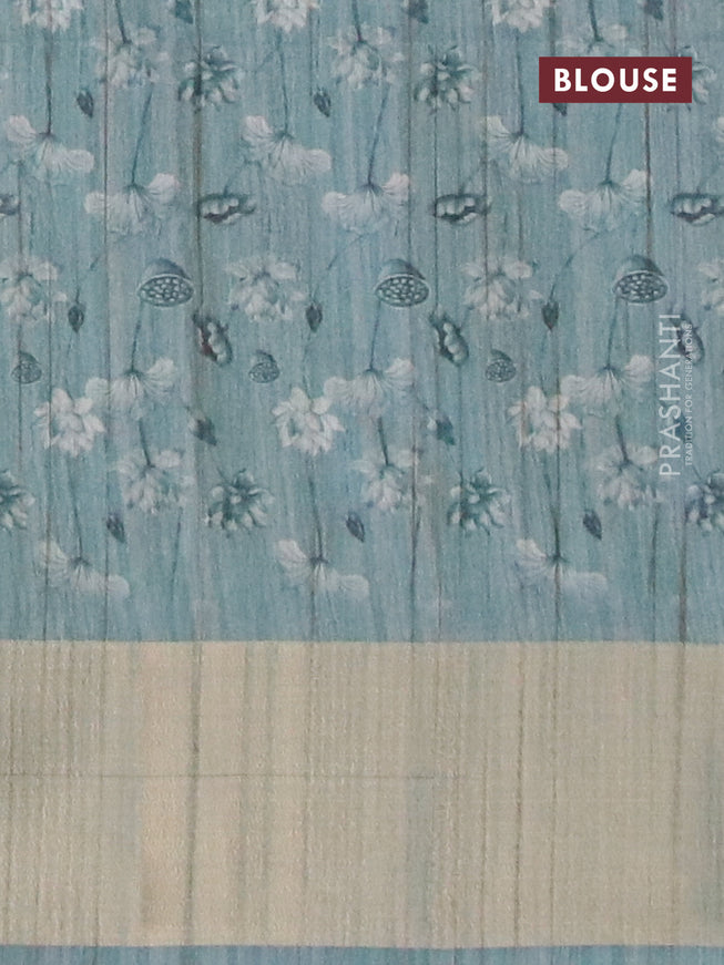 Semi matka saree pastel blue shade with allover floral prints and zari woven border