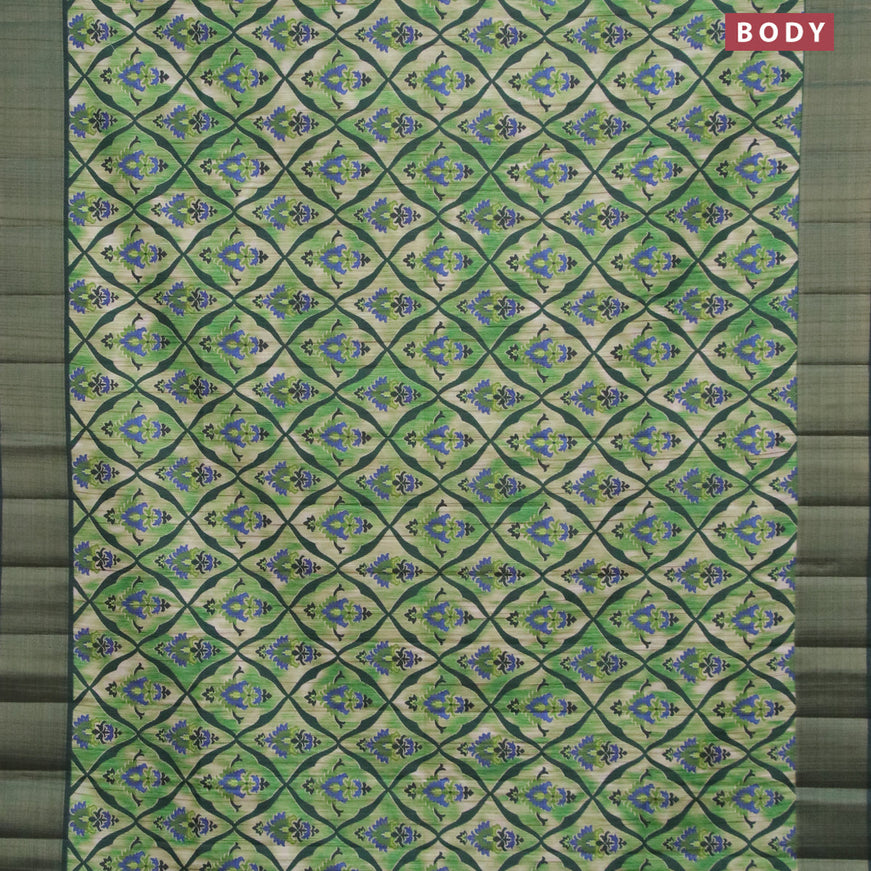 Semi matka saree light green and bottle green with allover prints and zari woven border