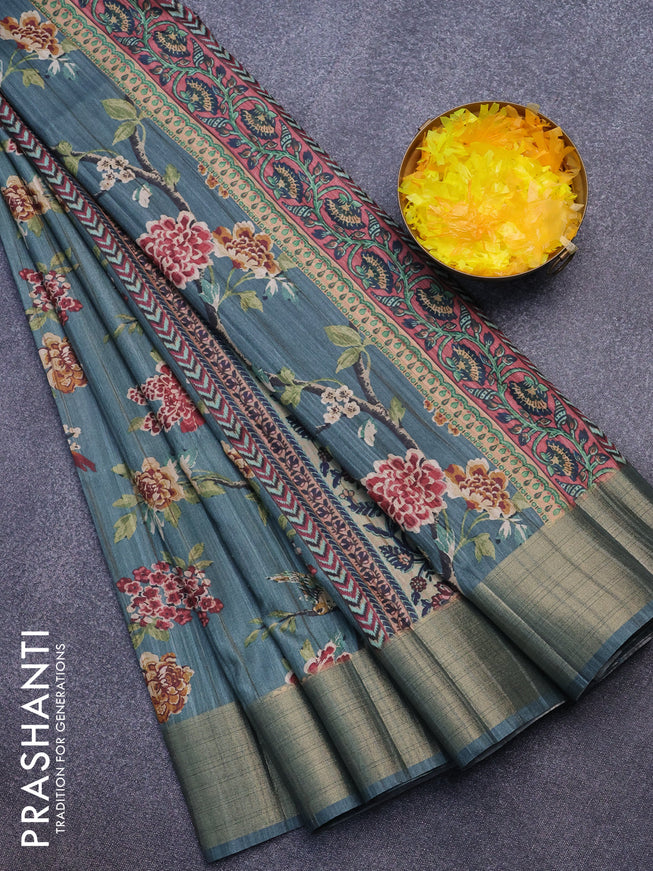 Semi matka saree pastel green shade with allover prints and zari woven border