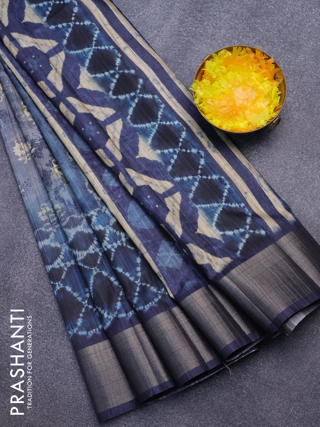 Semi matka saree pastel blue and navy blue with allover dabu prints and zari woven border