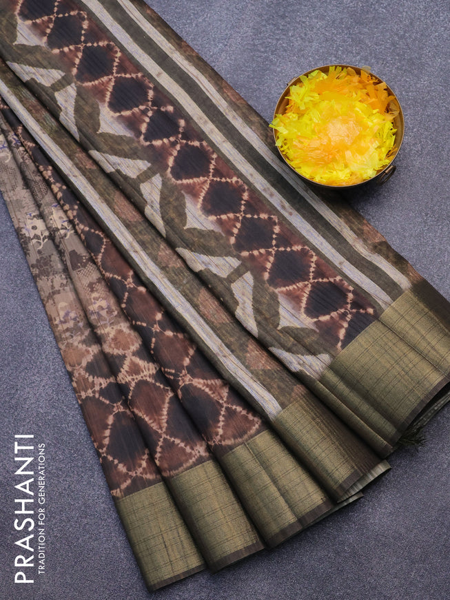 Semi matka saree brown and dark sap green with allover dabu prints and zari woven border