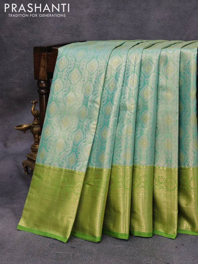 Bangalori tissue silk saree dual shade of teal blue and light green with allover zari woven brocade weaves and zari woven border