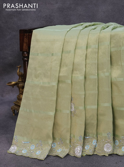 Tissue organza silk saree pastel green with sequin work buttas and beaded & sequin work border with sequin work readymade blouse