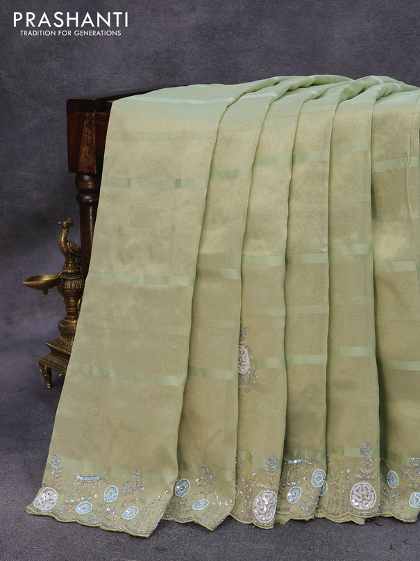 Tissue organza silk saree pastel green with sequin work buttas and beaded & sequin work border with sequin work readymade blouse