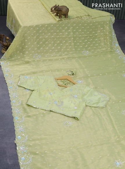 Tissue silk saree pista green with allover zari woven buttas and beaded & sequin work border with sequin work readymade blouse