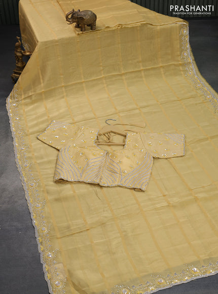 Tissue organza silk saree pale yellow with allover self emboss & zari weaves and beaded work border with sequin work readymade blouse