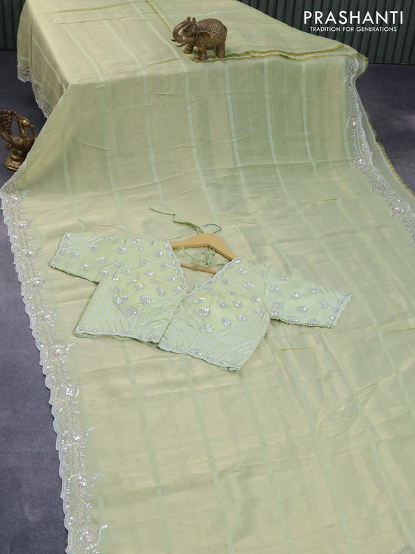 Tissue organza silk saree pista green with allover self emboss & zari weaves and beaded work border with sequin work readymade blouse