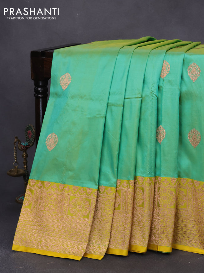 Pure banarasi katan silk saree green shade and yellow with copper zari woven buttas and copper zari woven border