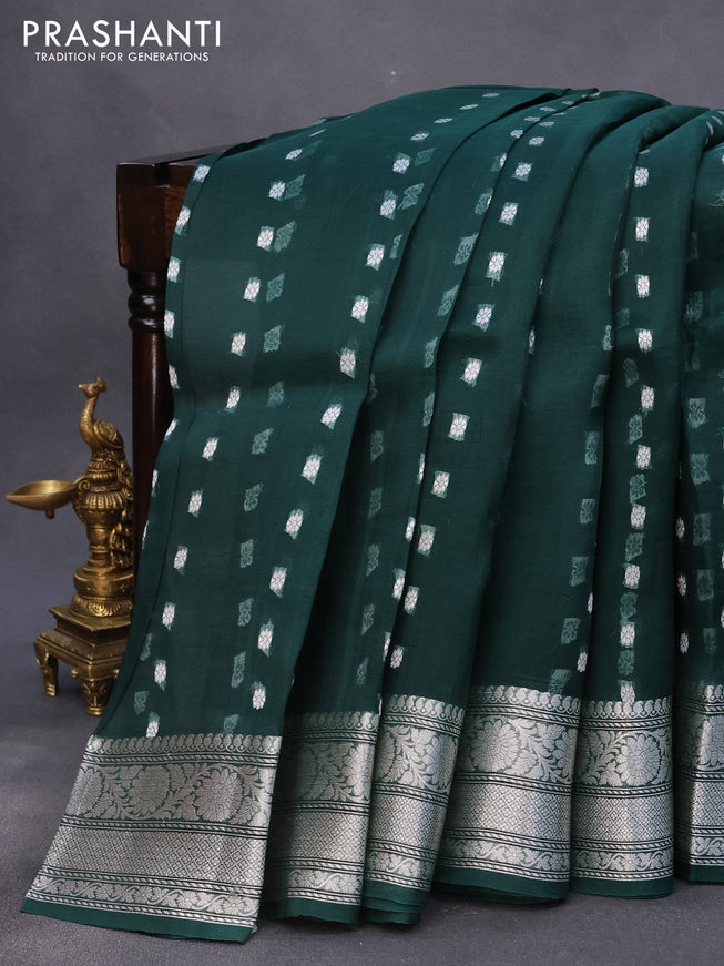 Banarasi organza silk saree dark peacock green with allover silver zari woven buttas and silver zari woven border