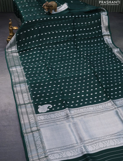 Banarasi organza silk saree dark peacock green with allover silver zari woven buttas and silver zari woven border