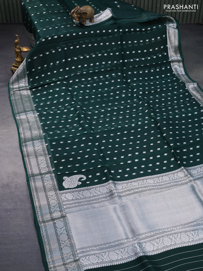 Banarasi organza silk saree dark peacock green with allover silver zari woven buttas and silver zari woven border