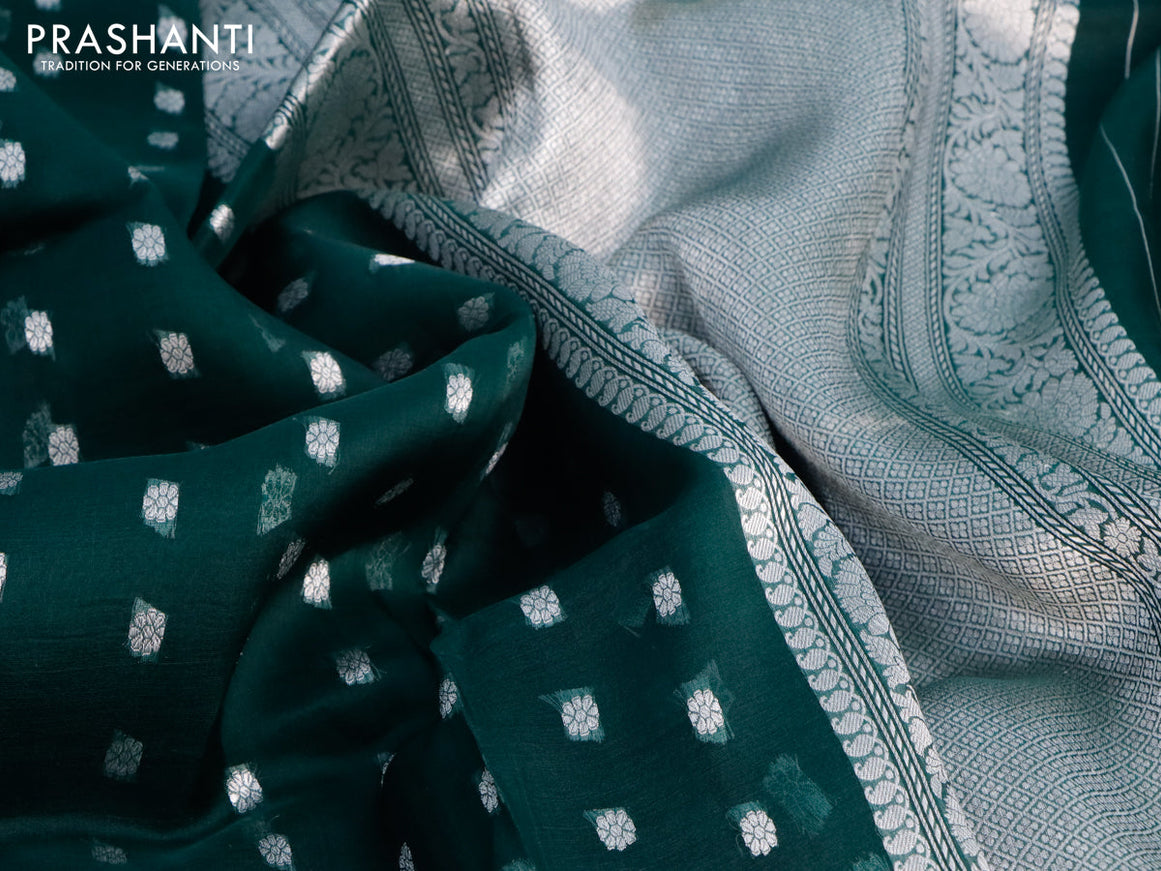 Banarasi organza silk saree dark peacock green with allover silver zari woven buttas and silver zari woven border