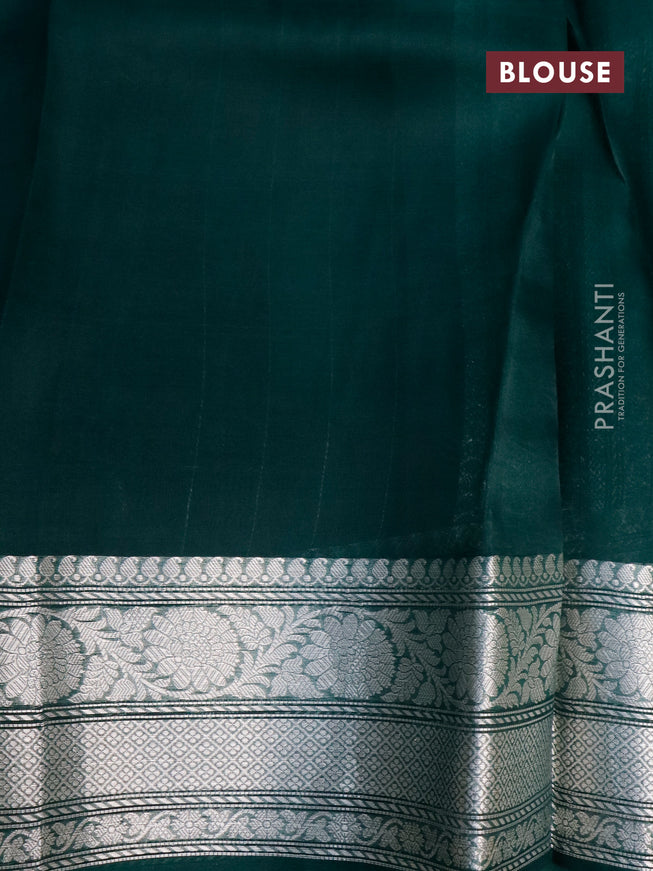 Banarasi organza silk saree dark peacock green with allover silver zari woven buttas and silver zari woven border