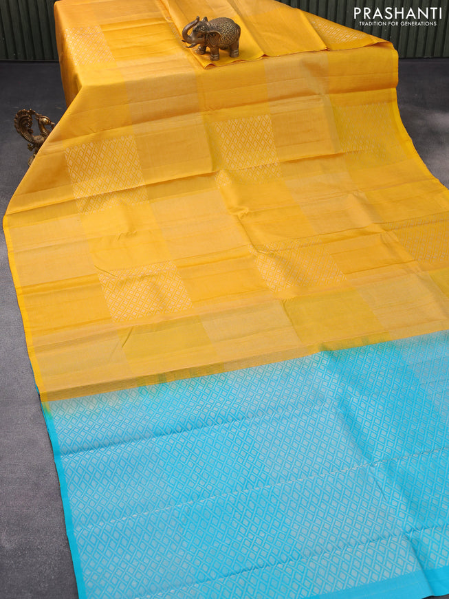 Pure soft silk saree yellow and dual shade of teal blue with allover silver zari woven brocade weaves in borderless style