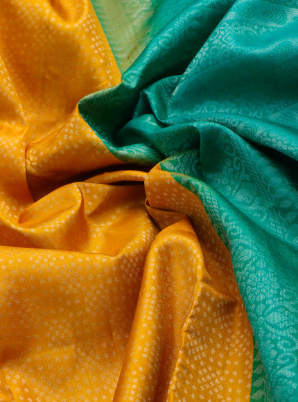 Pure soft silk saree mango yellow and teal green with allover silver zari woven brocade weaves and long silver zari woven border