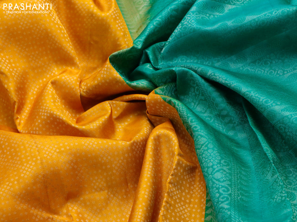 Pure soft silk saree mango yellow and teal green with allover silver zari woven brocade weaves and long silver zari woven border