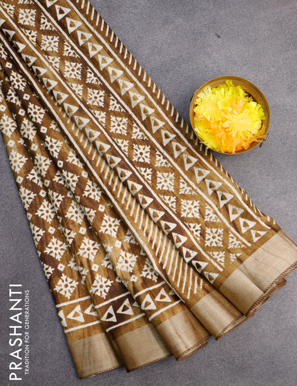 Semi tussar saree dark mehendi green with allover butta prints and zari woven border