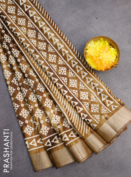 Semi tussar saree dark mehendi green with allover butta prints and zari woven border