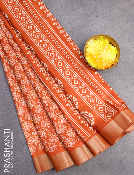 Semi tussar saree rustic orange with allover butta prints and zari woven border