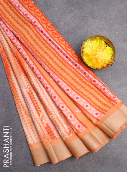 Semi tussar saree pale orange with allover prints and zari woven border