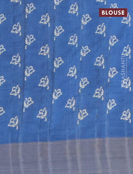 Semi tussar saree blue with allover prints and zari woven border