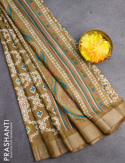 Semi tussar saree mehendi green with allover prints and zari woven border