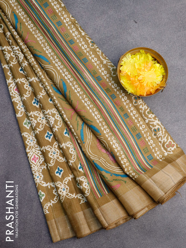 Semi tussar saree mehendi green with allover prints and zari woven border