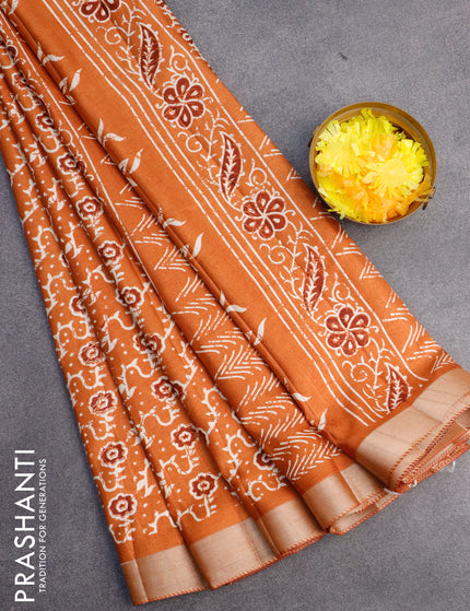 Semi tussar saree rustic orange with allover floral prints and zari woven border