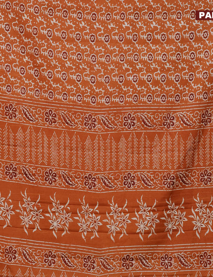 Semi tussar saree rustic orange with allover floral prints and zari woven border