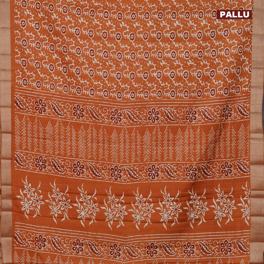 Semi tussar saree rustic orange with allover floral prints and zari woven border