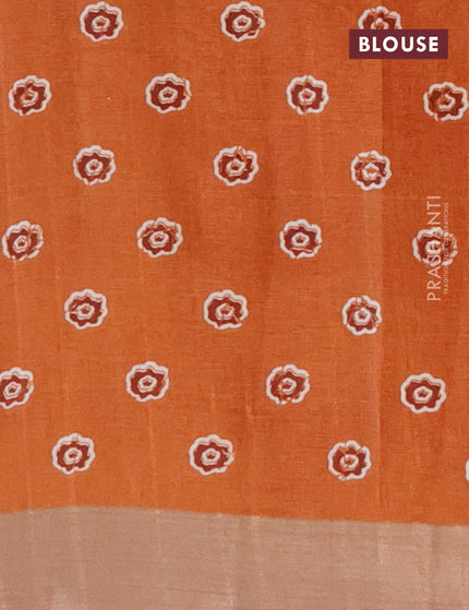 Semi tussar saree rustic orange with allover floral prints and zari woven border