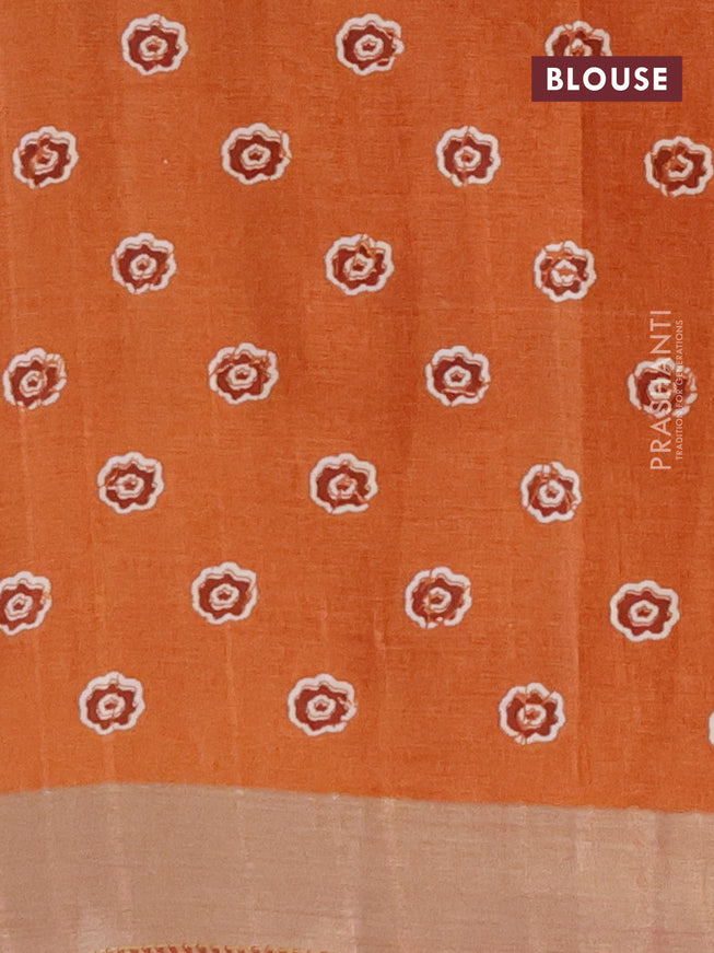 Semi tussar saree rustic orange with allover floral prints and zari woven border