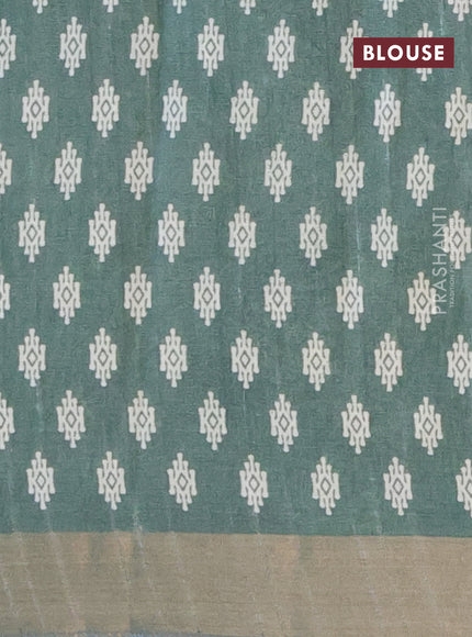 Semi tussar saree green shade with allover geometric prints and zari woven border