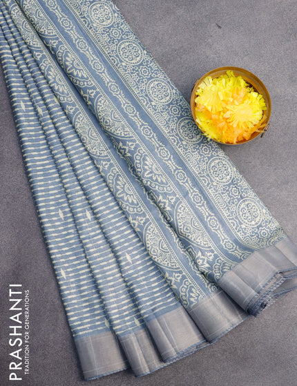 Semi tussar saree bluish grey with allover prints and zari woven border